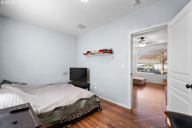 bedroom with hardwood / wood-style floors