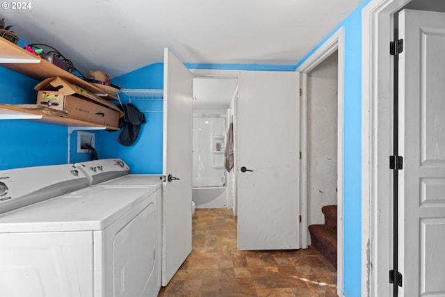 clothes washing area with separate washer and dryer