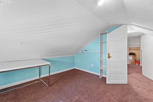 bonus room featuring carpet floors, a textured ceiling, and vaulted ceiling