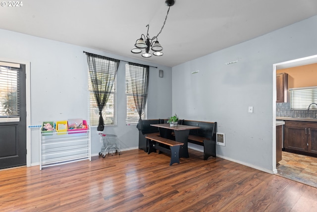 425 NW 3rd Ave, Canby, OR 97013 - dining space featuring light wood-style flooring, a chandelier, and baseboards