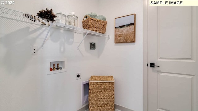 laundry room featuring laundry area, washer hookup, and electric dryer hookup