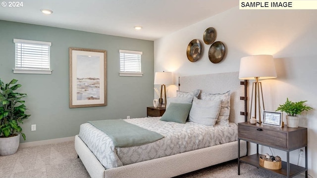 carpeted bedroom featuring baseboards