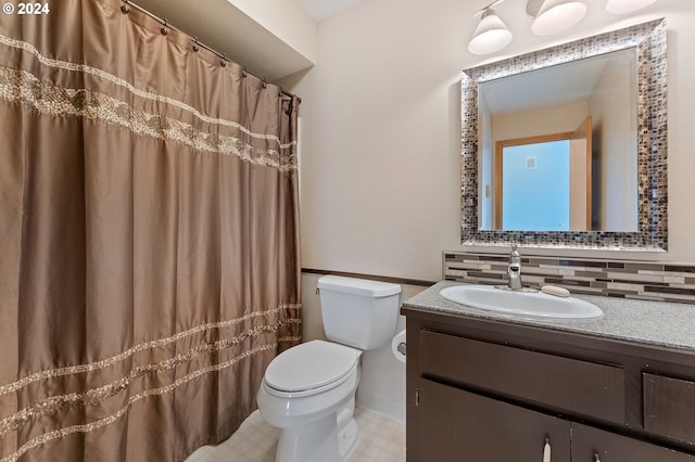 bathroom featuring toilet, tasteful backsplash, tile patterned flooring, and vanity