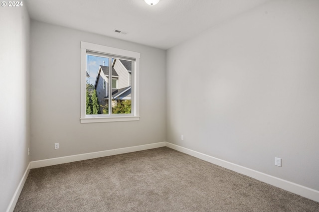 spare room featuring carpet flooring