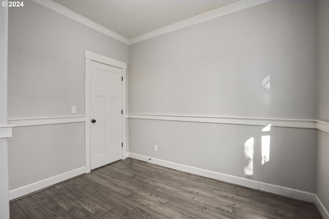 unfurnished room featuring crown molding and hardwood / wood-style floors