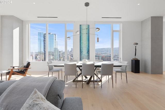 dining space featuring light wood-type flooring