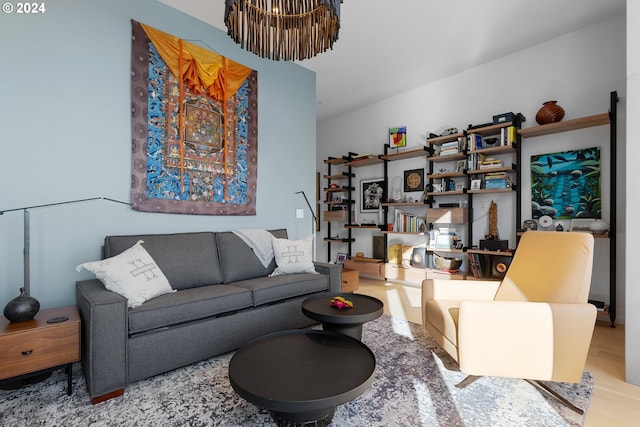 living room with a chandelier and hardwood / wood-style flooring