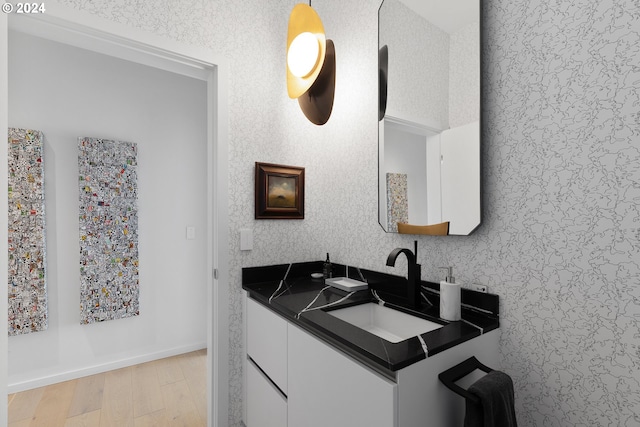 bathroom featuring vanity and hardwood / wood-style flooring