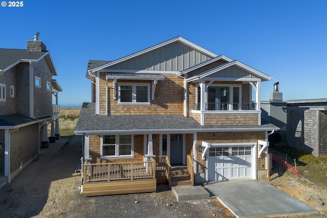 view of front of house featuring a garage and covered porch