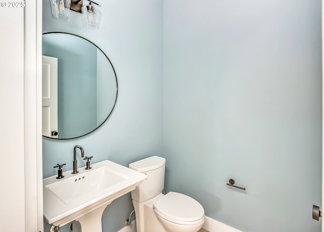 bathroom with sink and toilet