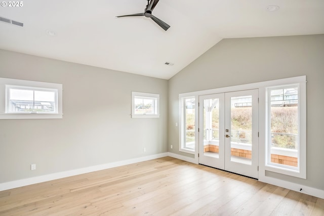 interior space featuring french doors, ceiling fan, vaulted ceiling, and light hardwood / wood-style flooring