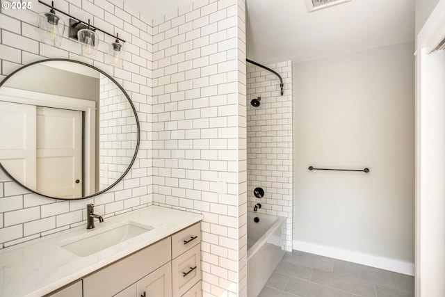 bathroom featuring tile walls, decorative backsplash, tiled shower / bath combo, vanity, and tile patterned floors