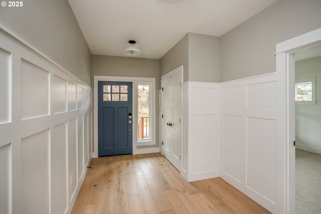 entrance foyer featuring plenty of natural light and light wood-type flooring