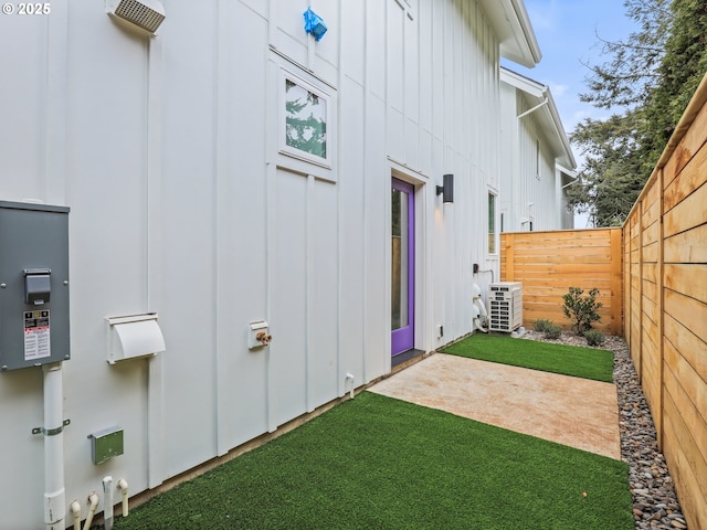 view of yard featuring a patio and central air condition unit