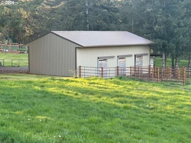 view of outdoor structure with a lawn