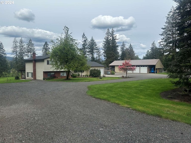 view of front facade with a garage and a front lawn