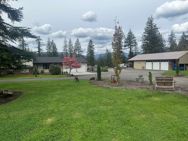 view of yard featuring a garage