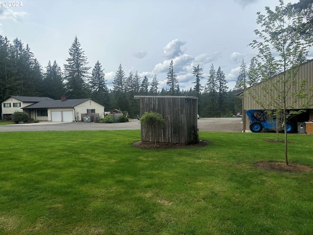 view of yard with a garage