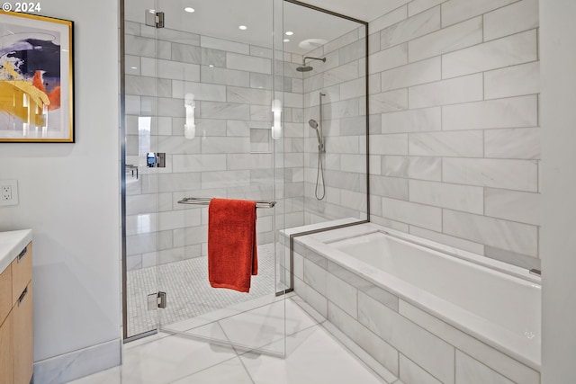 full bath featuring vanity, a shower stall, and a bath