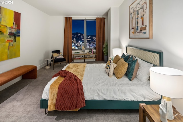 bedroom with carpet and baseboards