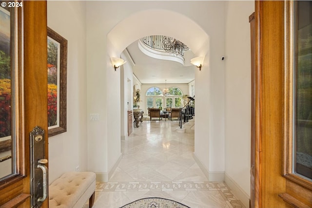 hallway with light tile patterned floors