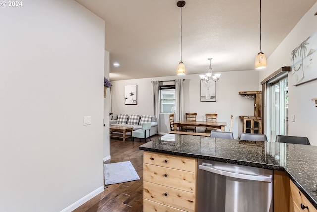 kitchen featuring hanging light fixtures, dishwasher, and plenty of natural light