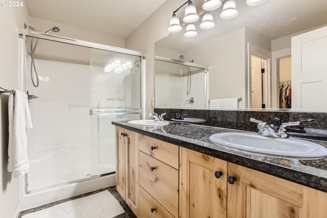 bathroom with walk in shower and vanity