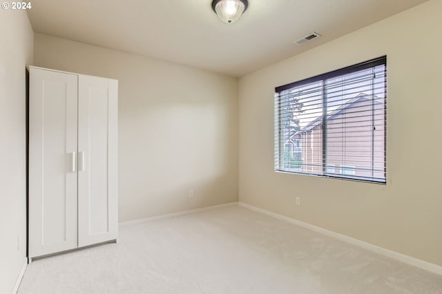 interior space featuring light colored carpet