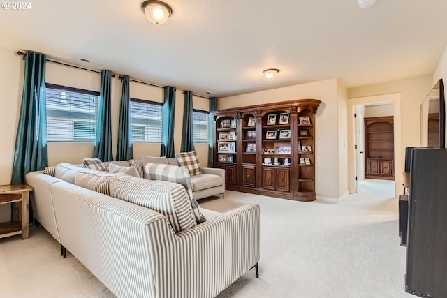 living room featuring light carpet