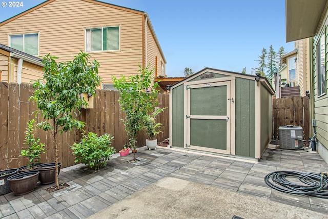 exterior space with a storage unit and central air condition unit