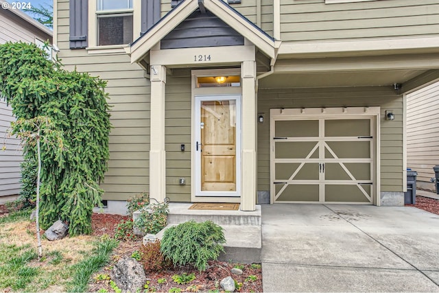 view of exterior entry with a garage