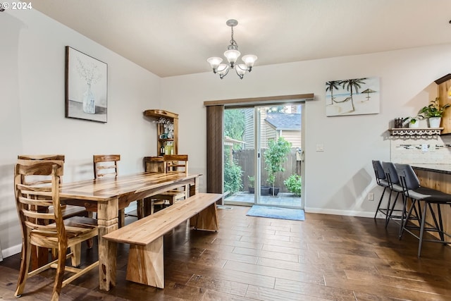 dining space featuring an inviting chandelier and dark hardwood / wood-style floors