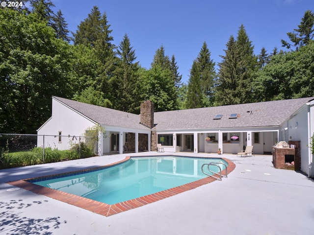 view of swimming pool with a patio