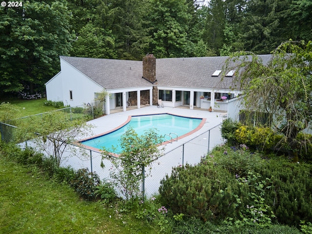 view of swimming pool featuring a patio