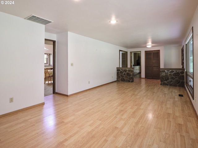 unfurnished living room with light hardwood / wood-style flooring