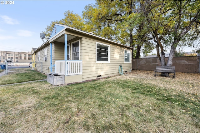 view of side of property featuring a yard