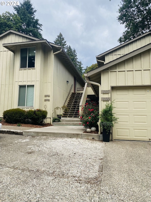 7161 Childs Rd, Lake Oswego, OR 97034 - property entrance with board and batten siding and a garage