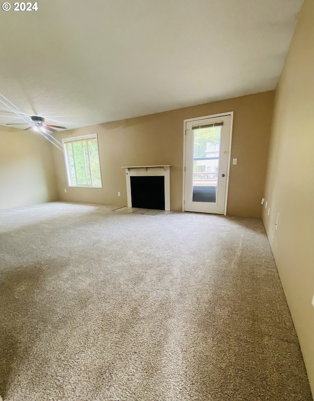 7161 Childs Rd, Lake Oswego, OR 97034 - unfurnished living room with carpet, a fireplace with flush hearth, and a ceiling fan