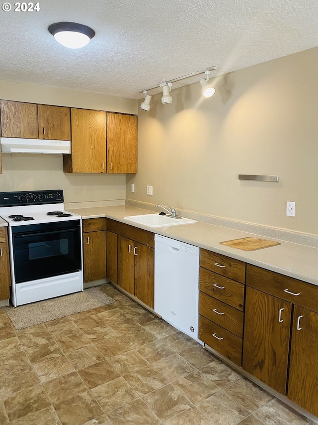 7161 Childs Rd, Lake Oswego, OR 97034 - kitchen featuring electric range, dishwasher, a sink, under cabinet range hood, and a textured ceiling