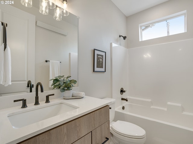 full bathroom featuring  shower combination, a notable chandelier, toilet, and vanity