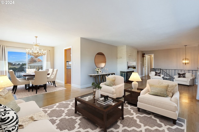 living room with a chandelier and hardwood / wood-style floors