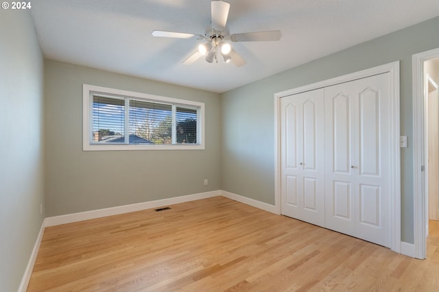 unfurnished bedroom with a closet, ceiling fan, and light hardwood / wood-style flooring