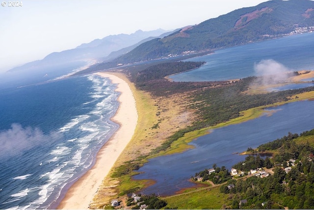 mountain view featuring a water view and a beach view