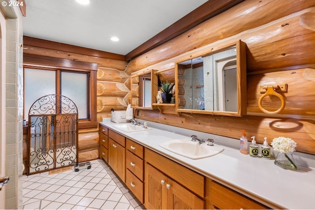 bathroom with double sink vanity, tile flooring, and rustic walls