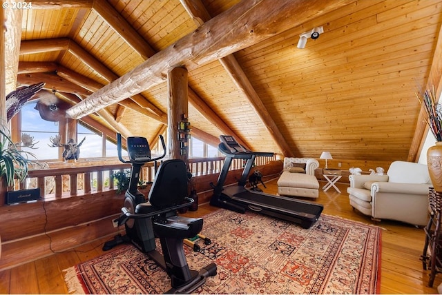 interior space with wooden walls, wood ceiling, lofted ceiling, and light wood-type flooring