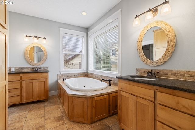 bathroom with a bathing tub and vanity