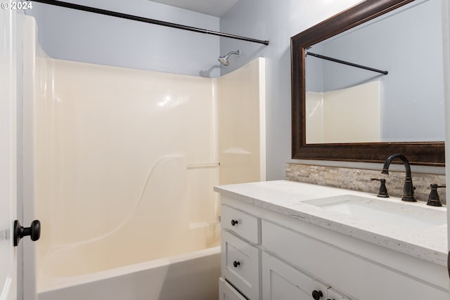 bathroom with bathtub / shower combination and vanity