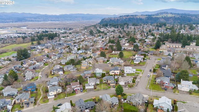 birds eye view of property featuring a mountain view