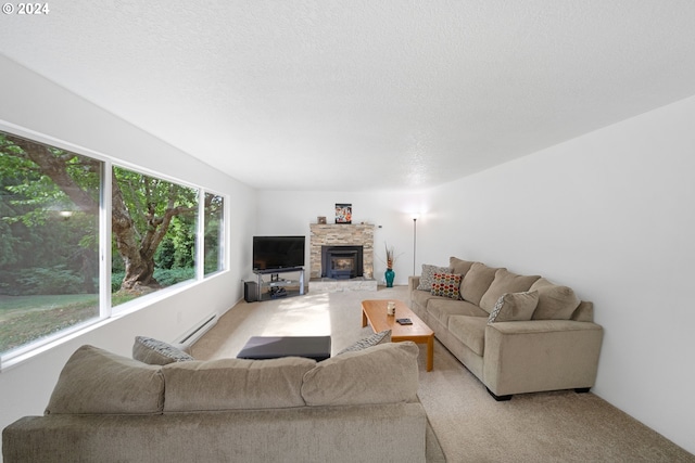 carpeted living room featuring a textured ceiling, a fireplace, and baseboard heating