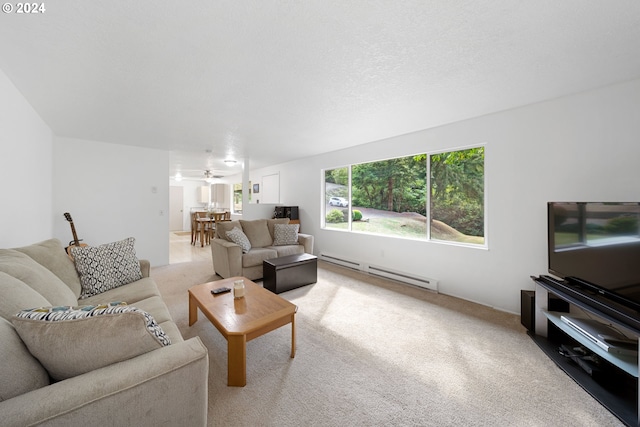 carpeted living room with ceiling fan, a baseboard radiator, and a textured ceiling